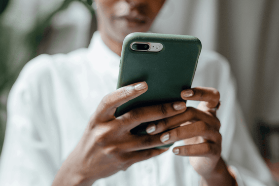 woman searching folic acid on her phone